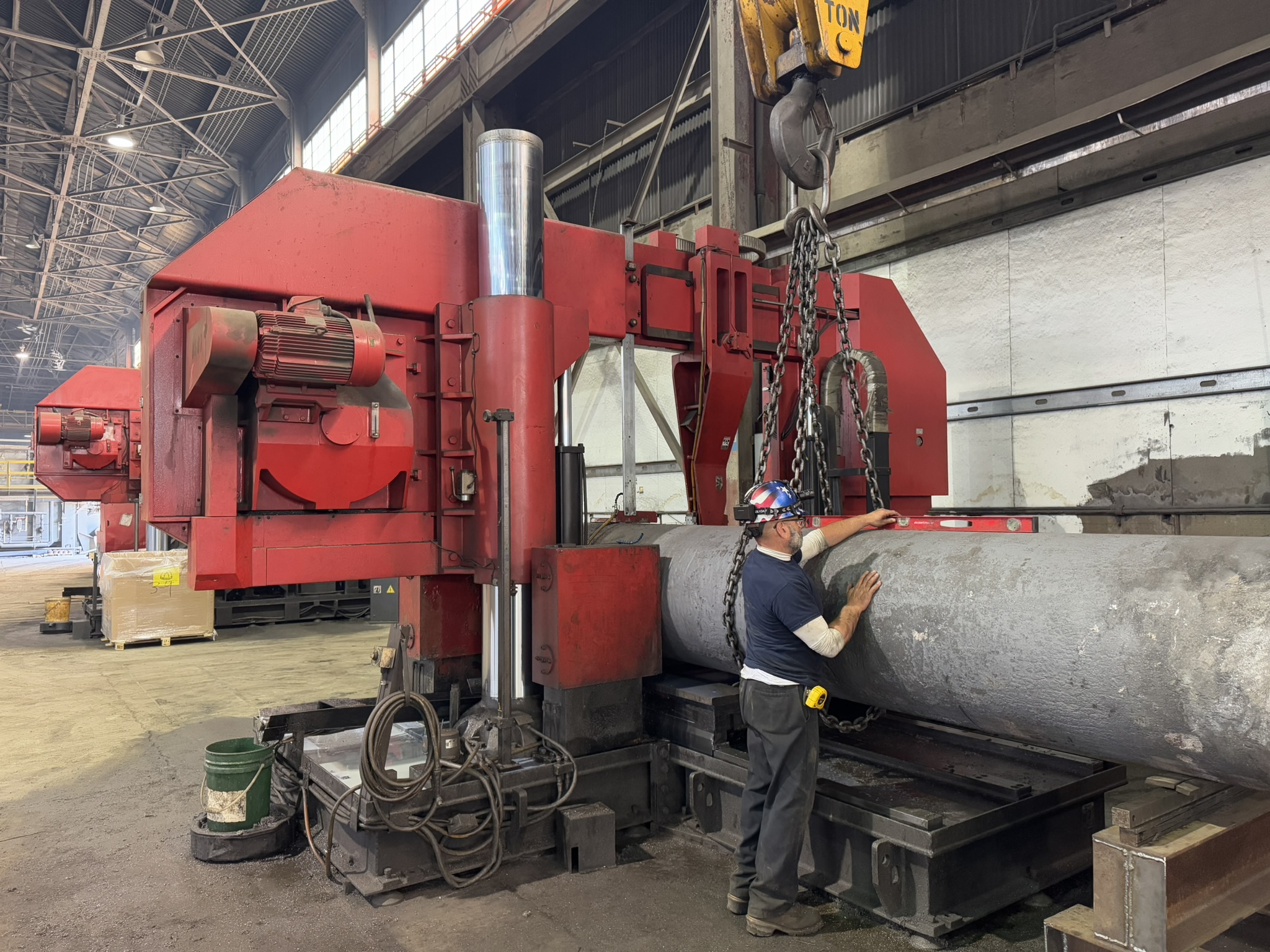 Bandsaw cutting through titanium billet at MSI Corporation