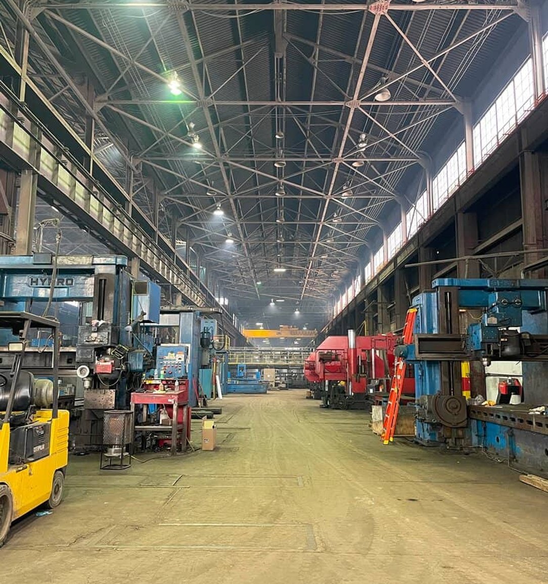 Wide interior view of a large heavy machinery manufacturing facility